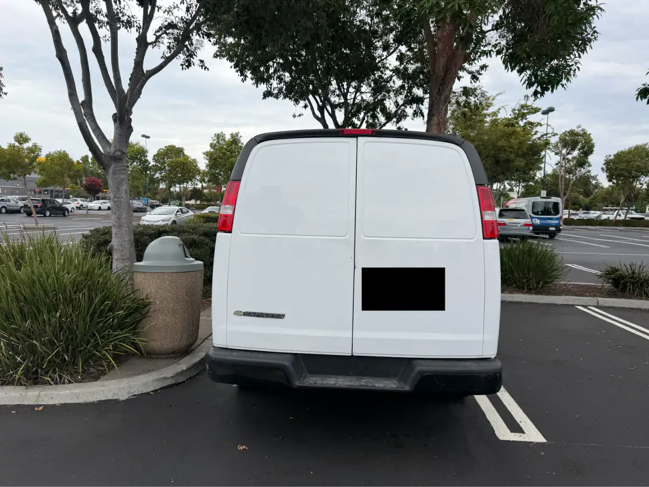 White Chevrolet Express cargo van, rear
